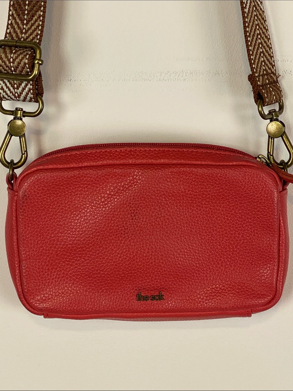 The Sak Red Pebbled Leather Crossbody with Woven Strap